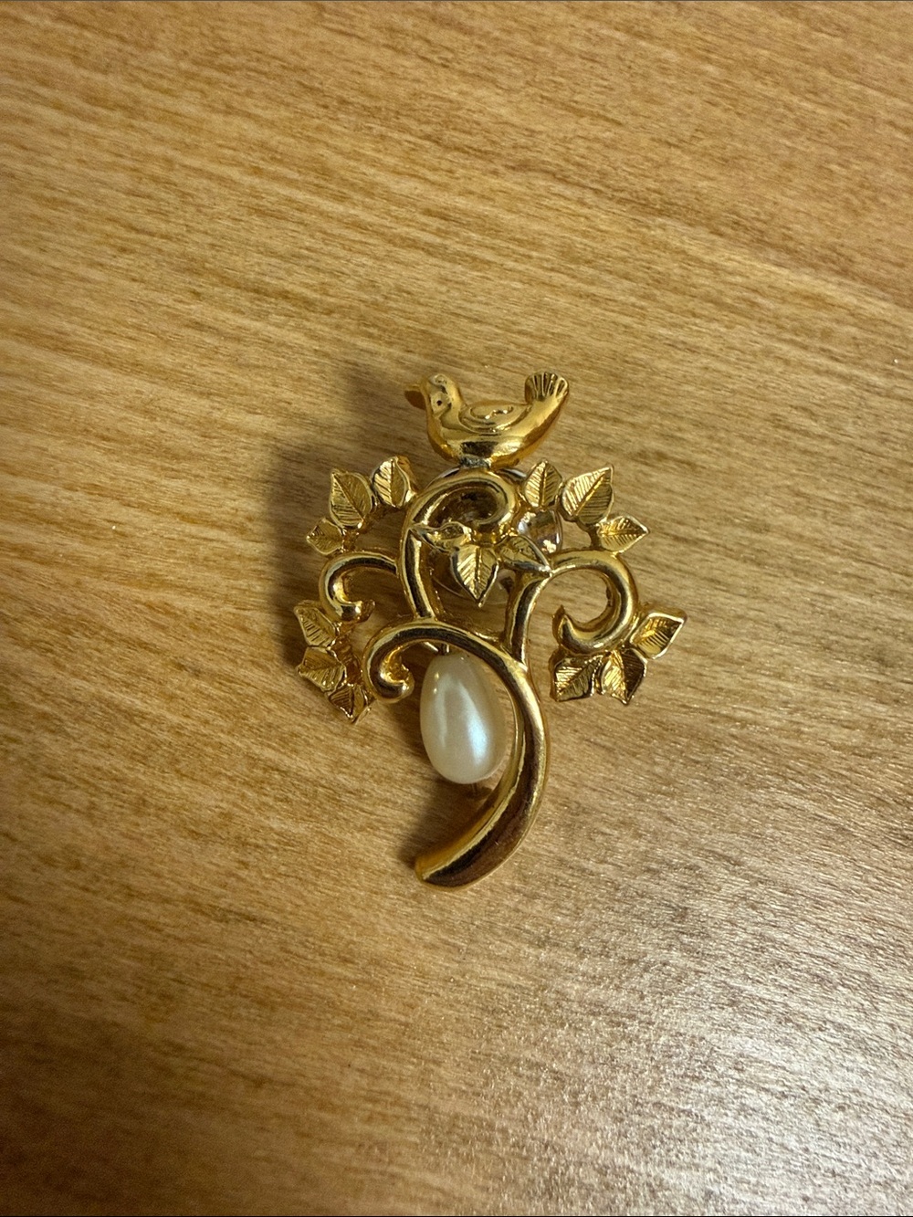 Gold tone bird on tree pin